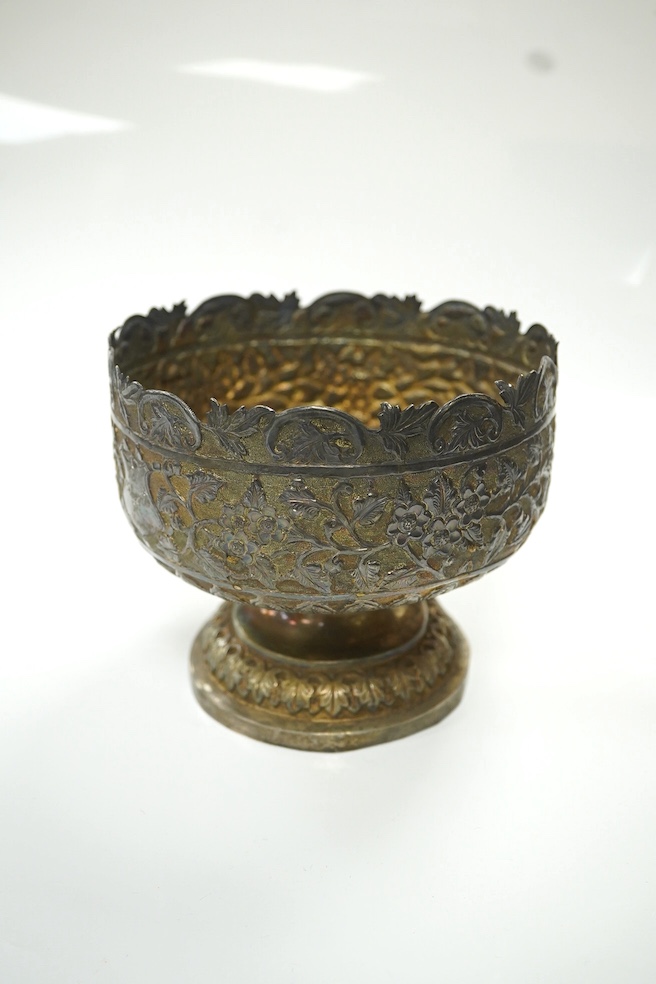 Two early to mid 20th century Indian white metal pedestal bowls, including one embossed with continuous hunting scene, diameters 14.2mm and 13.8mm, 18.1oz. Condition - poor